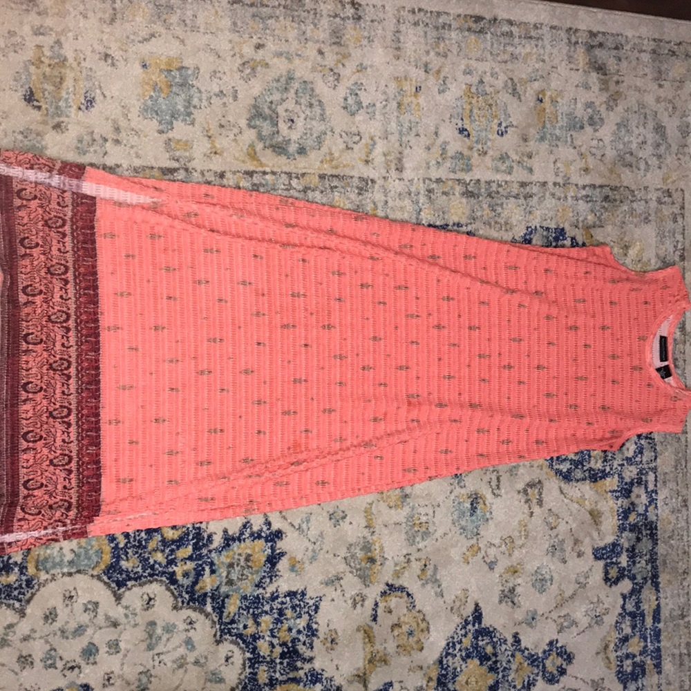 A beautiful fairly worn sleeveless dress